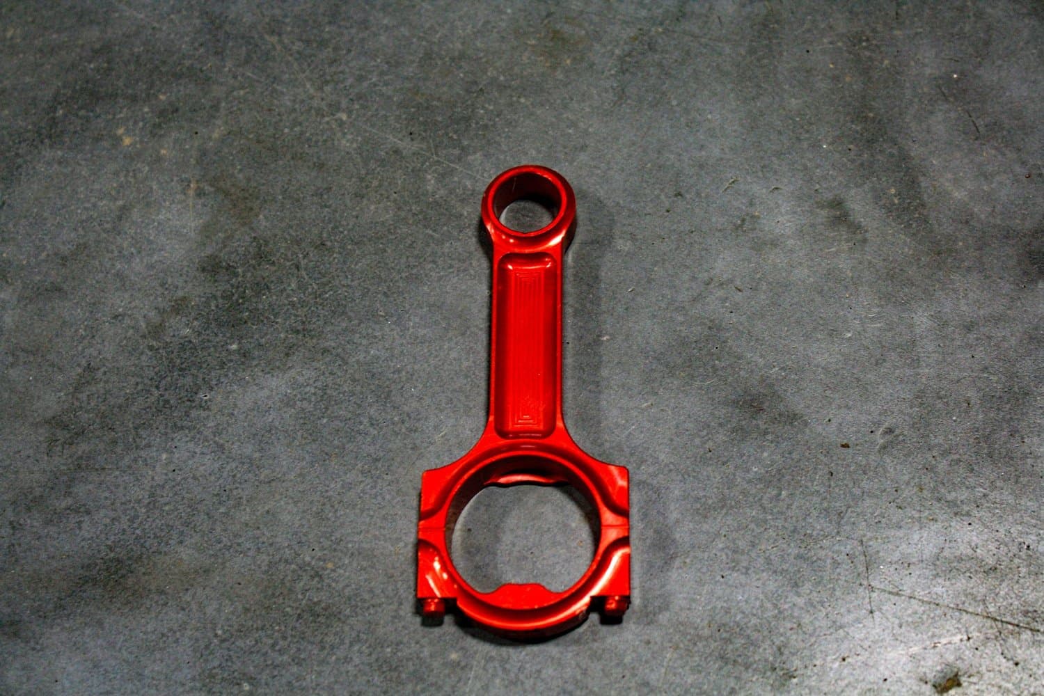Red anodized billet aluminum connecting rod bottle opener