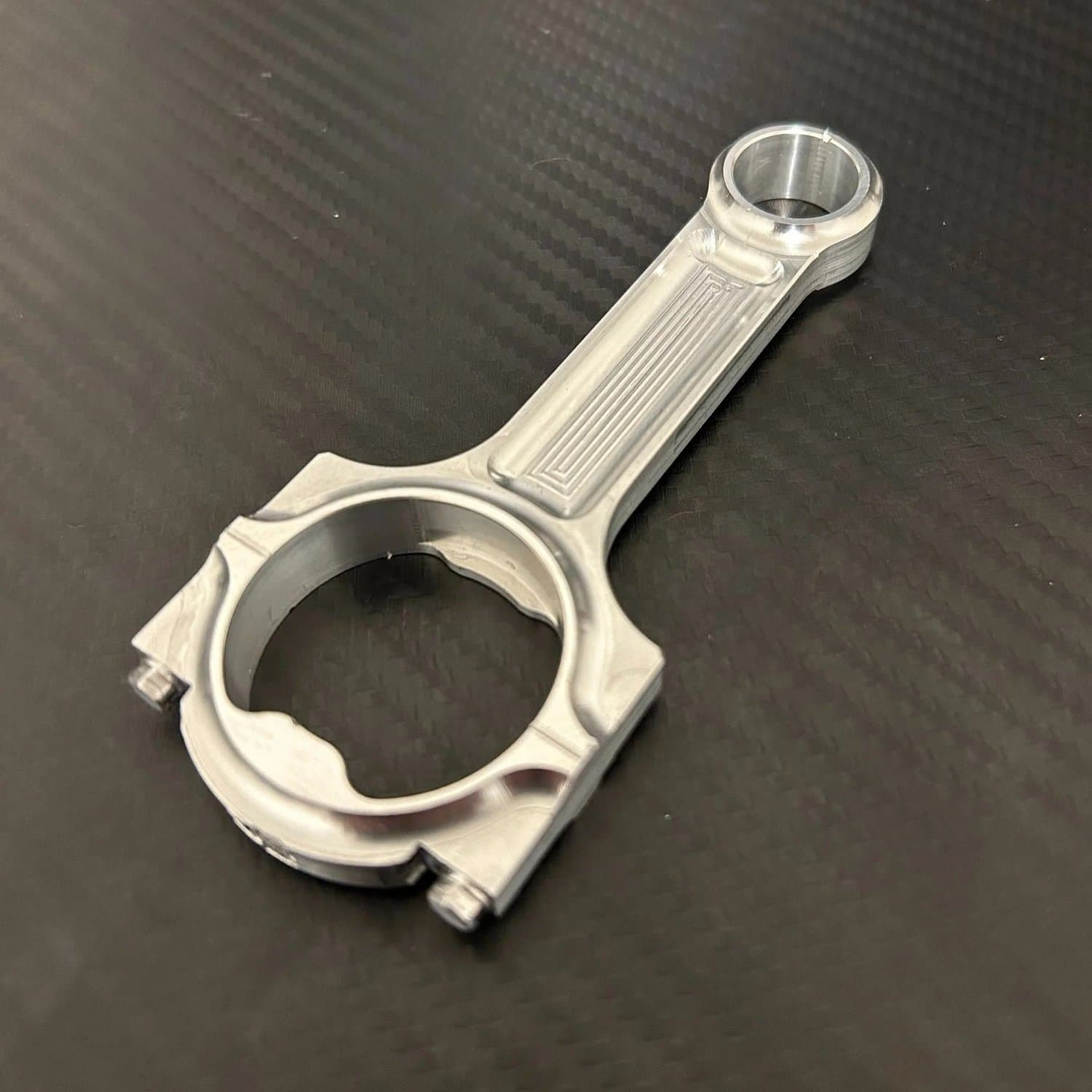 Machine finish billet aluminum connecting rod bottle opener